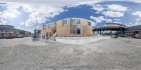 a 360 - view of a building with a bike parked near it at the entrance