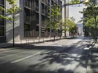 two parked bikes on the side of an empty street in city city area, near building