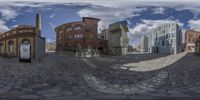 there are many buildings seen in this 360 - view image of them with one street light near the front