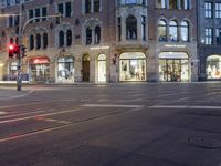 the street is empty but not as many traffic is in motion as the cars drive