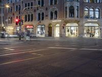 the street is empty but not as many traffic is in motion as the cars drive