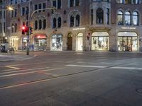 the street is empty but not as many traffic is in motion as the cars drive