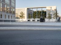 a road on the right side and buildings in the back are empty for vehicles to drive