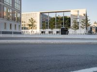 a road on the right side and buildings in the back are empty for vehicles to drive