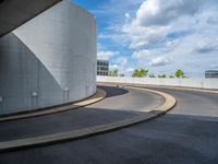 a car is driving on the highway through an underground parking garage area in a city