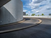 a car is driving on the highway through an underground parking garage area in a city