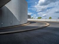 a car is driving on the highway through an underground parking garage area in a city