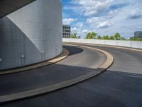 a car is driving on the highway through an underground parking garage area in a city