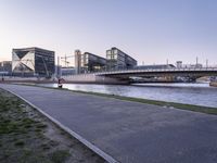 a city street in the middle of a river and a bench on the side of it