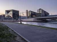 a city street in the middle of a river and a bench on the side of it