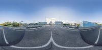 a fish eye lens of an empty street outside a city center or something in the distance