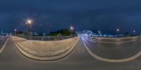 a street with the lights turned off on either side of it and long lines of white paint on the street