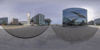 three distorted pictures of a square, square and pyramid building on the same street in front of buildings