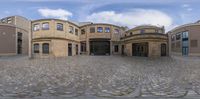 a building is shown with a view through the panoramic lens of it, as it looks out towards the road