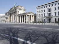 a photo of the street outside of the city building, taken on an empty day