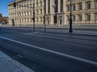 two lanes that appear to be in the middle of the road, and are straight lines to the left