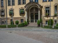 large yellow building with some plants and bushes in front of it for decoration or entertainment