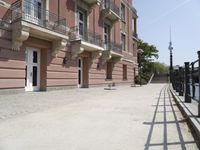 a row of buildings that have balconies on them by the water's edge