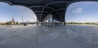 two panoramas of a building with curved walls and a clock tower behind them that reads i love you