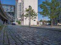 Berlin's Cobblestone Roads Under Clear Skies