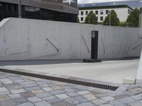 a skateboarder is doing tricks down a ramp at the skate park in an urban setting