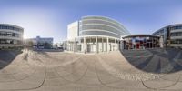 a round building with some curved windows is featured in the middle of a 360 - lens