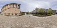 a building with a view of a circle outside it, which appears to be a courtyard