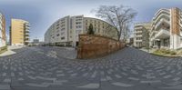 an 360 - ray view of the streets of a city with buildings and apartment blocks