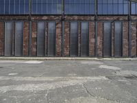 a man is standing in front of an empty building with no doors in it,