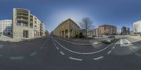 this is a fish eye view of the streets in europe where you can see the cars and building