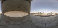 a large stone wall is seen in this perspective view of a skate park half - pipe