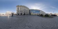 a round panorama on a plaza with several buildings and buildings in the background in europe