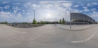 this is the view of a large building in a fish eye lens looking up at the ground