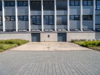 the sidewalk outside of a building with several buildings in front of it with some windows