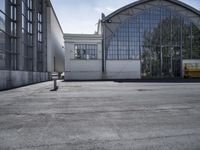 a parking meter is located in front of the building and looks out at the outdoors