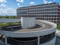 a car is driving on the highway through an underground parking garage area in a city