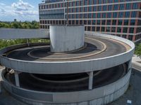 a car is driving on the highway through an underground parking garage area in a city