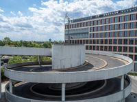 a car is driving on the highway through an underground parking garage area in a city