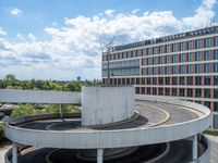 a car is driving on the highway through an underground parking garage area in a city