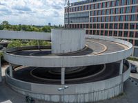 a car is driving on the highway through an underground parking garage area in a city