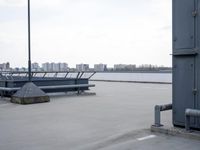 a boat is parked in an empty parking lot near an air port on the water
