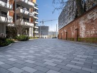 there is an alley way that is well paved by building on both sides and the street