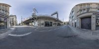 a panorama is shown of a city street in this image, there are curved streets