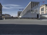 an image of a square at the entrance of a building being constructed by people around