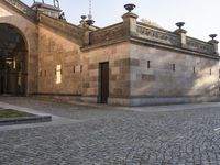 the courtyard of the building is shown with a yellow umbrella outside and on the sidewalk