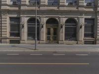 there is a large building along the street with a sign on it that says welcome to the department