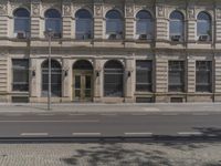 there is a large building along the street with a sign on it that says welcome to the department