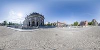 a 360 - view of a cathedral in an empty town square, with many streets