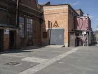 a large brick building with an abc logo on the side of it on a street