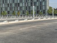 a bench is sitting in the middle of the road next to a highway with traffic lights